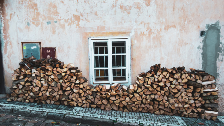 Why You Should Store Firewood Away From Your Home’s Foundation—And How to Do It&nbsp;Right
